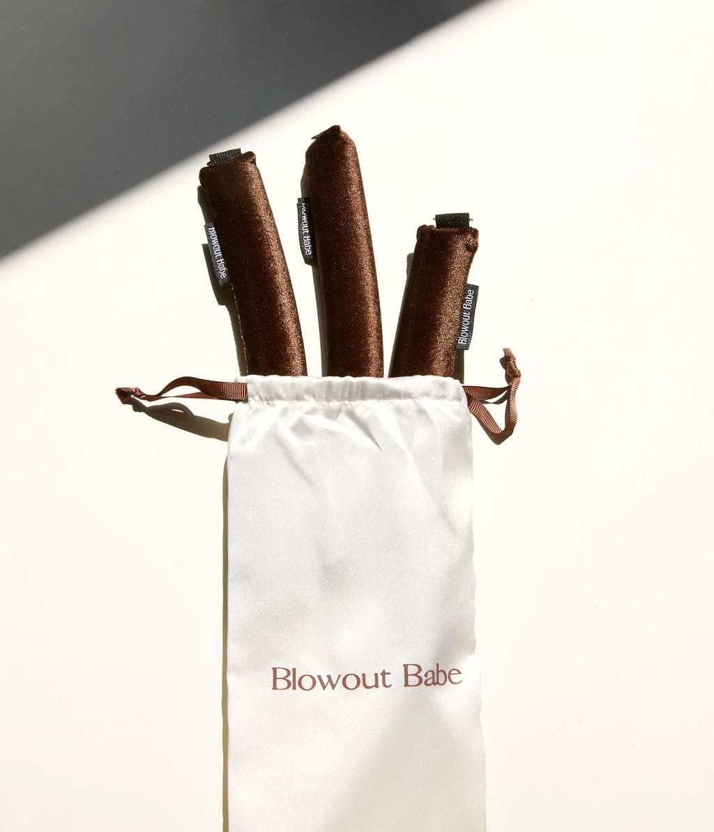 Brown Velvet heatless rods emerging from satin pouch packaging