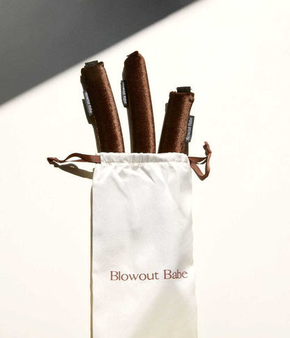 Brown Velvet heatless rods emerging from satin pouch packaging